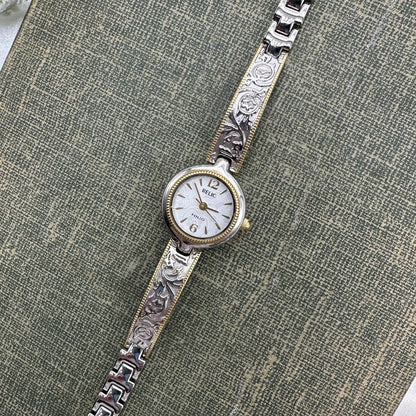 Silver and gold tone Relic watch with gorgeous detailed band and dial.