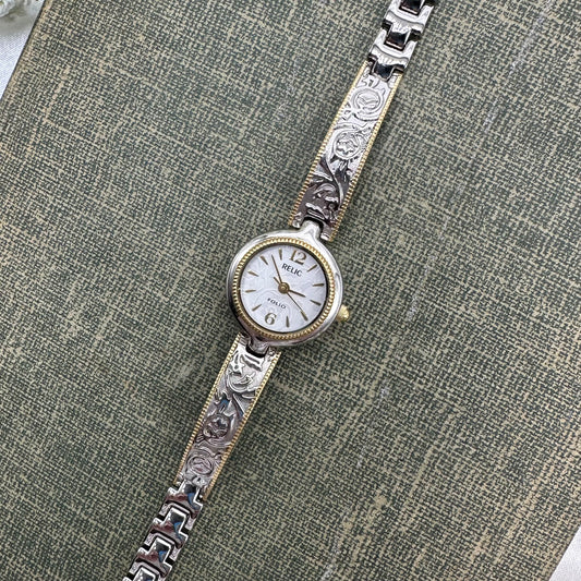 Silver and gold tone Relic watch with gorgeous detailed band and dial.