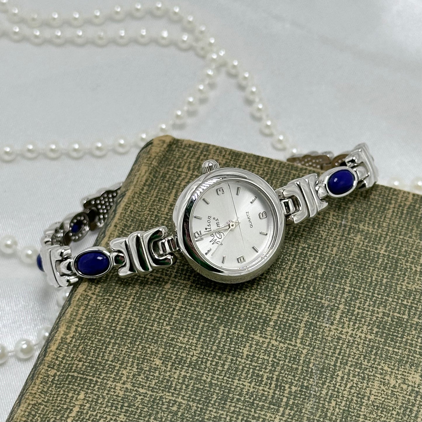 Silver Round Dial Watch with Blue Gemstone Band
