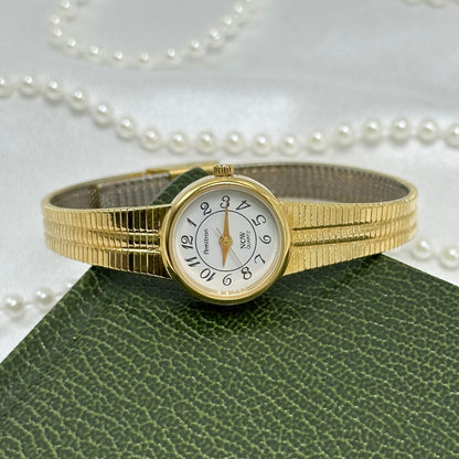 Slender Gold Armitron Watch with Round Dial