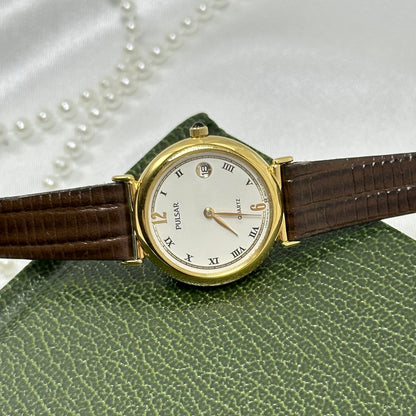 Vintage Gold Pulsar Watch with Brown Leather Band and Date Display