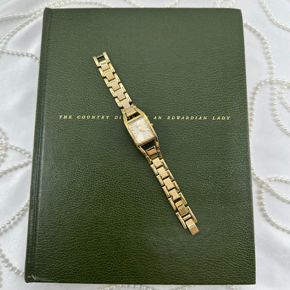 Classic Gold Nine & Company Watch with Rectangular Dial