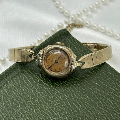 Dainty vintage gold tone Harman manual winding cocktail watch from the 1940's.