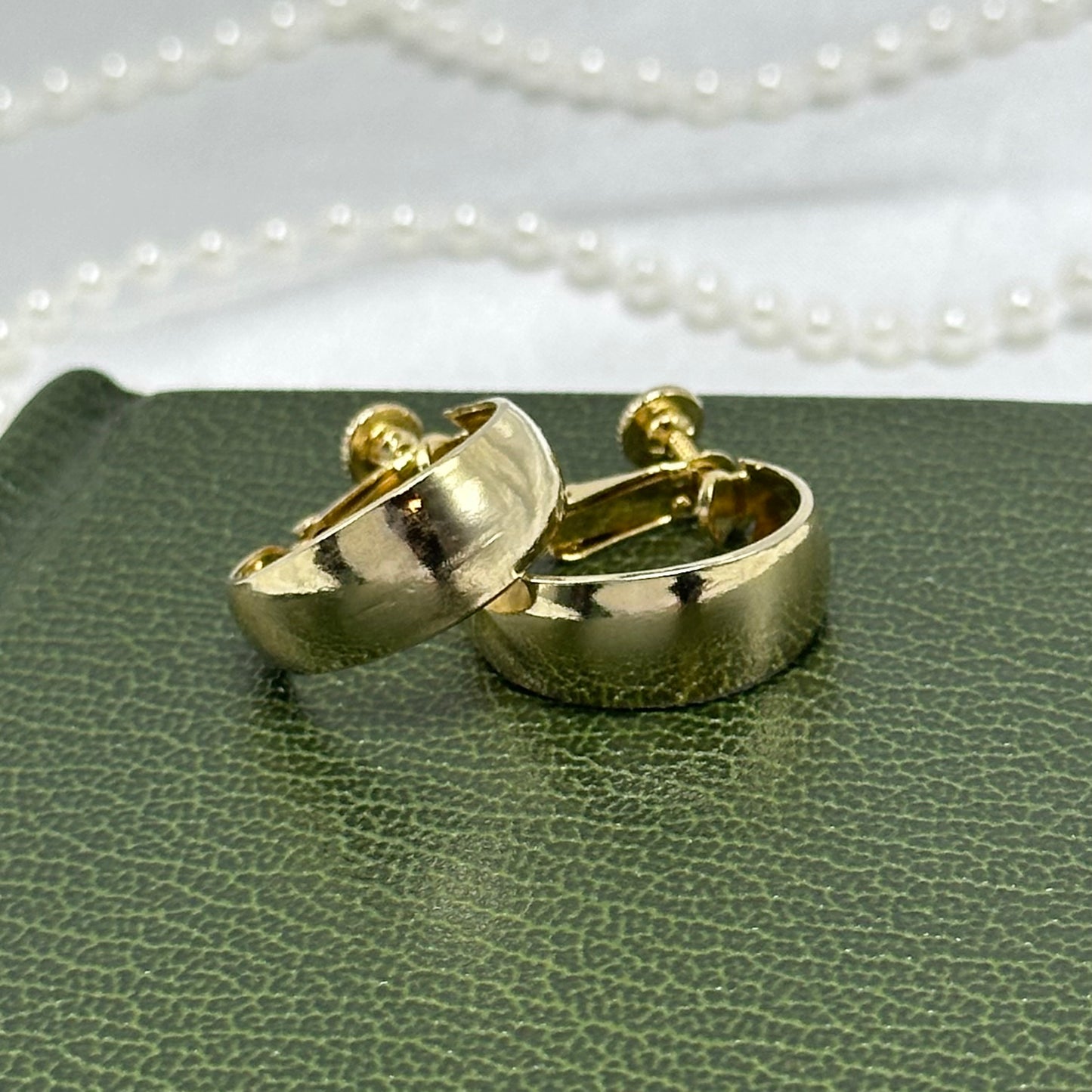 Classic vintage gold tone clip on screw back hoop earrings.