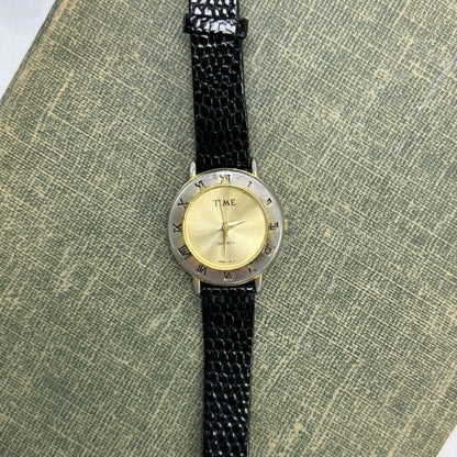 Gold Round Dial Watch with Roman Numeral Markers