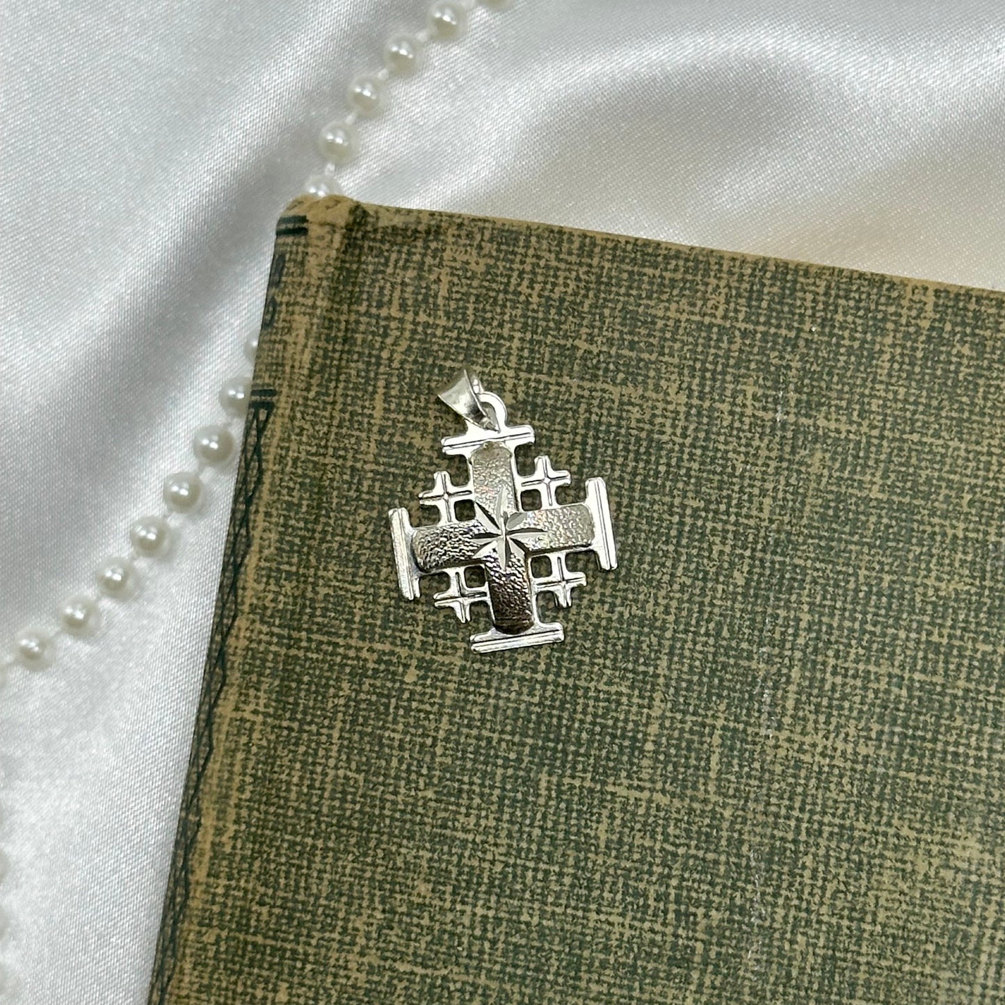 925 sterling silver Jerusalem pendant. Diamond cut front. Unique back design.