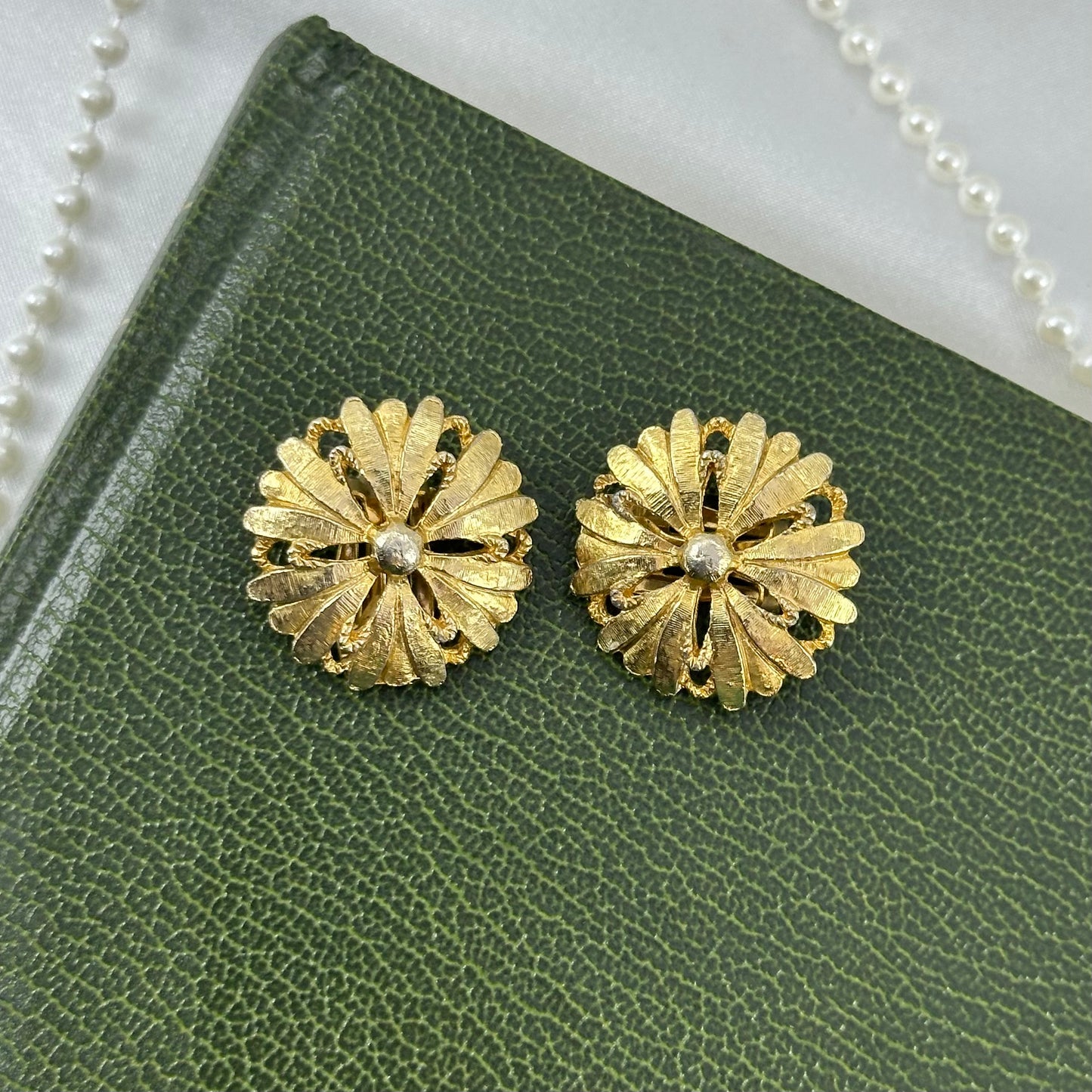 Vintage chunky gold tone flower clip on earrings.