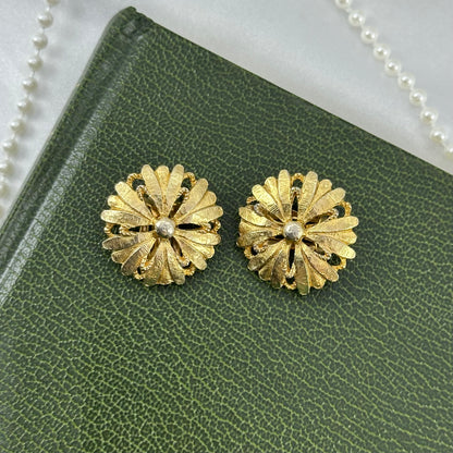 Vintage chunky gold tone flower clip on earrings.