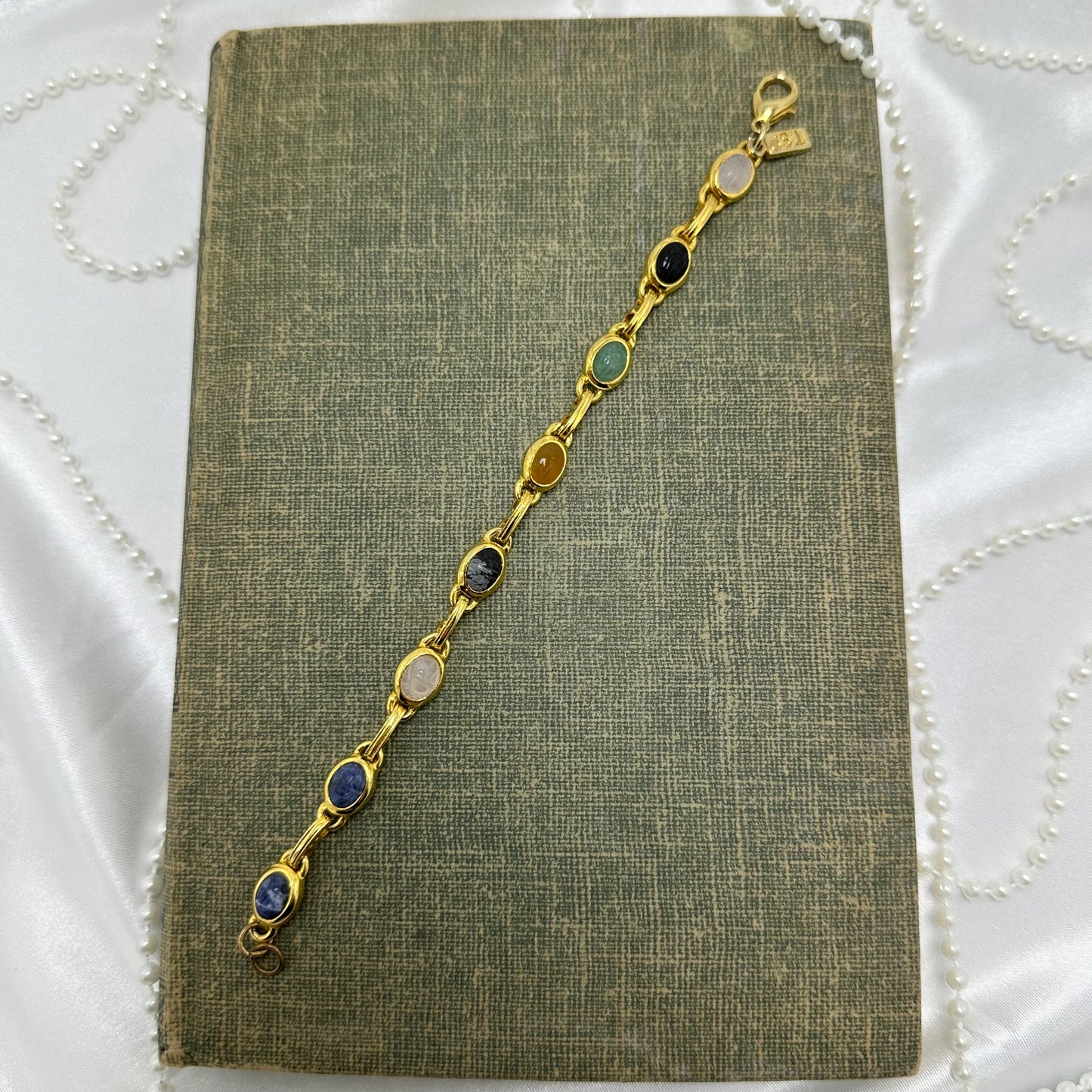 Dainty vintage gold tone bracelet with multicolor scarabs.