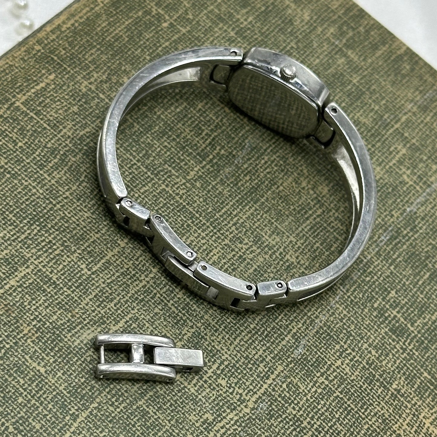 Silver Fossil Cuff Watch with Iridescent Dial