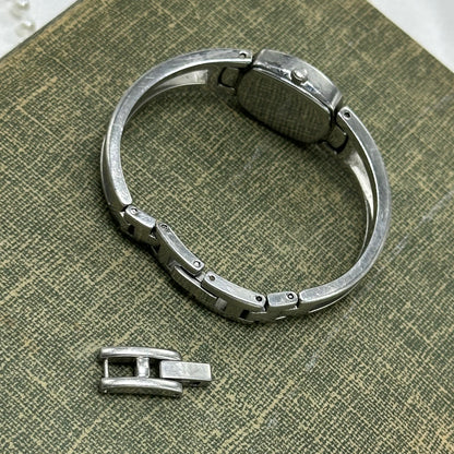 Silver Fossil Cuff Watch with Iridescent Dial