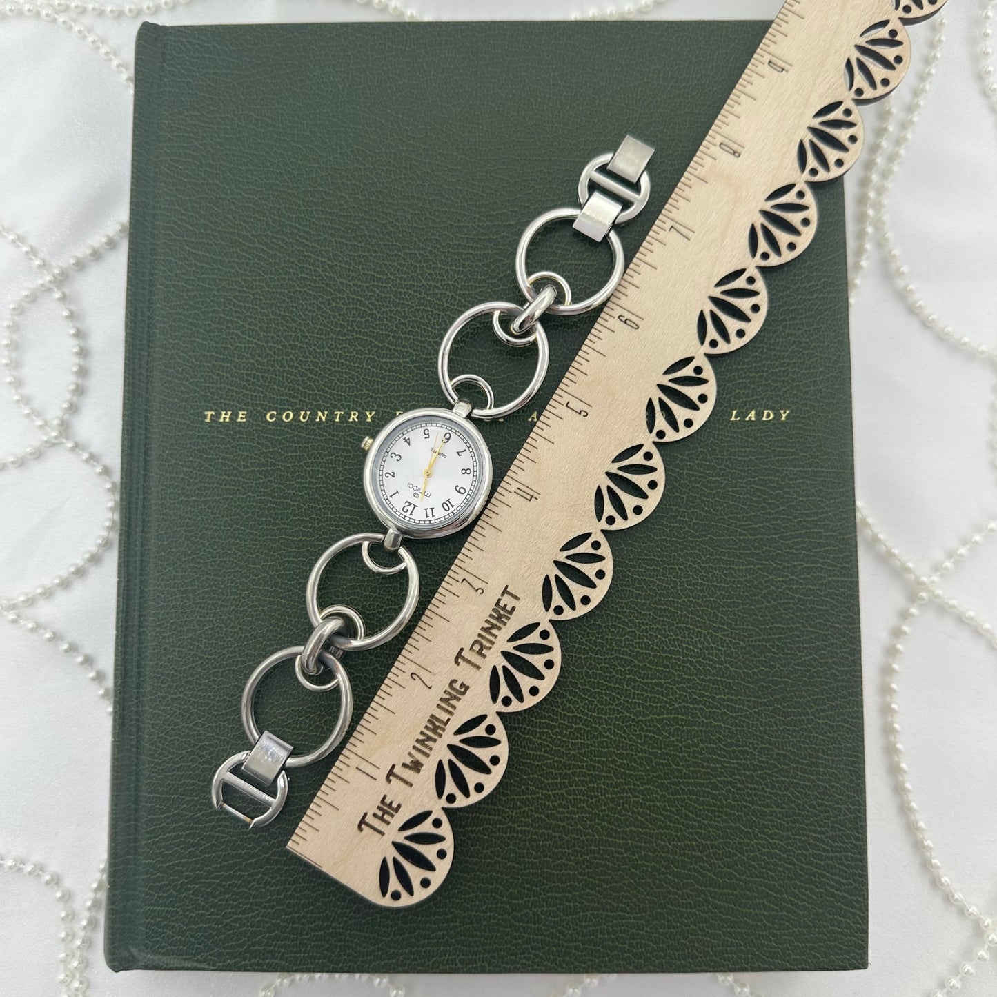 Round Dial Silver Minicci Watch with Gold Hands and Circle Links