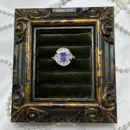Rhodium plated vintage deadstock ring with large pink heart shaped center stone surrounded by cubic zirconia stones.