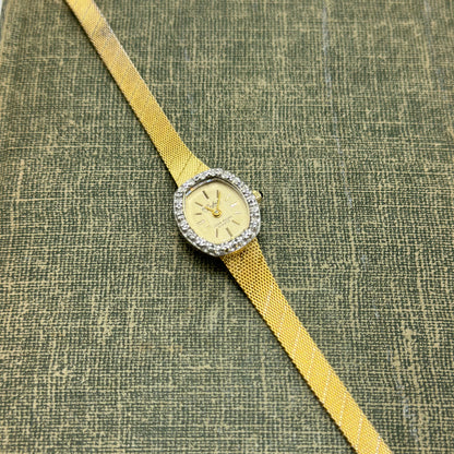 Gold Diamanté Lucien Piccard Watch with Blue Jewel Crown