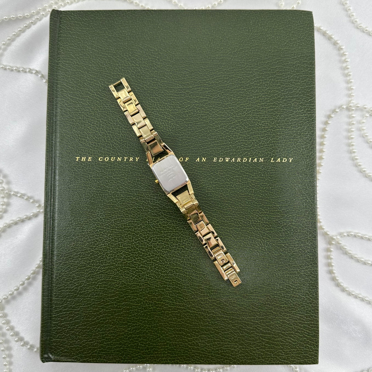 Classic Gold Nine & Company Watch with Rectangular Dial