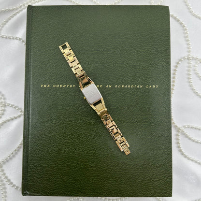 Classic Gold Nine & Company Watch with Rectangular Dial