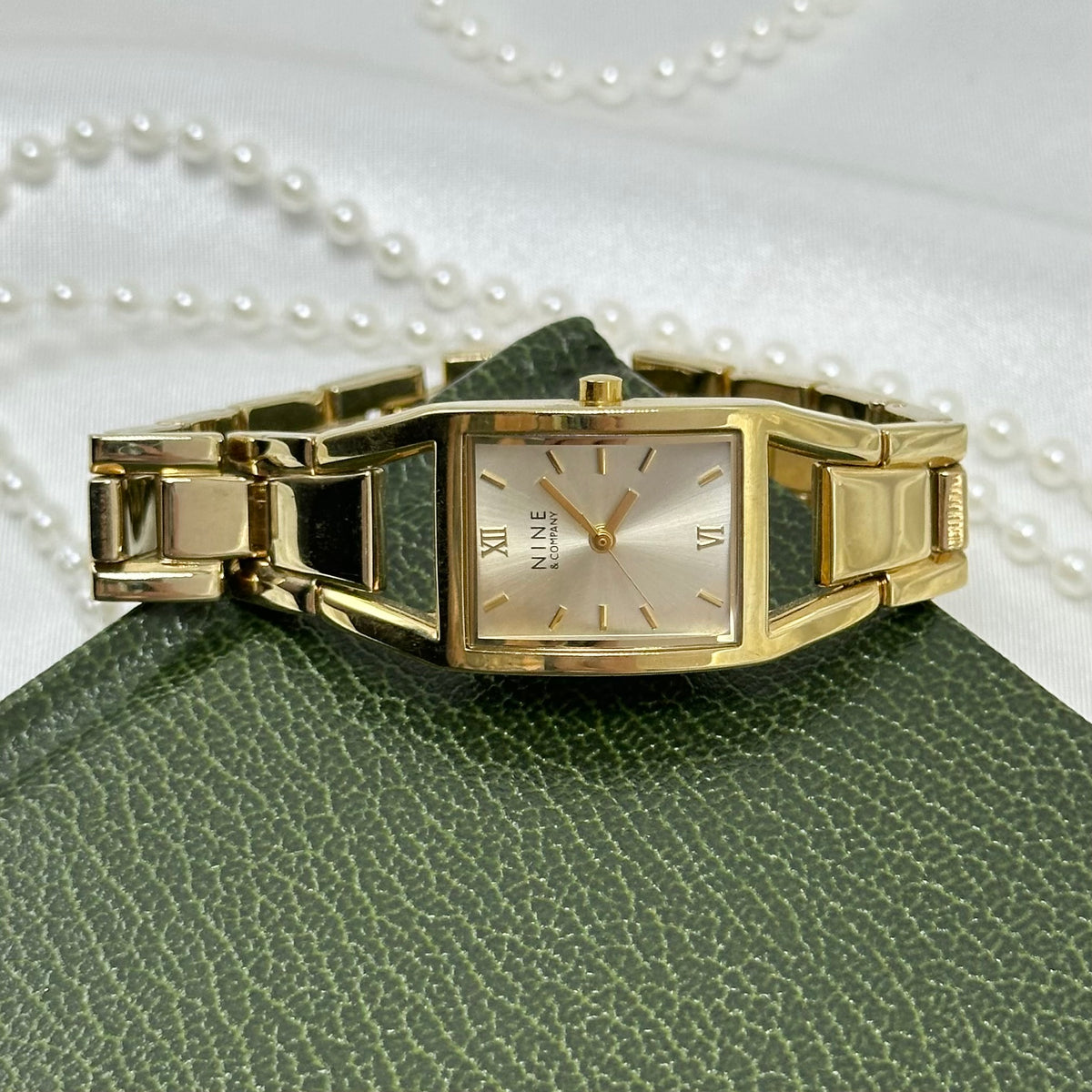 Classic Gold Nine & Company Watch with Rectangular Dial