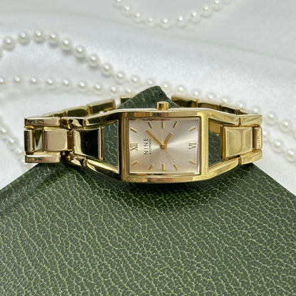 Classic Gold Nine & Company Watch with Rectangular Dial