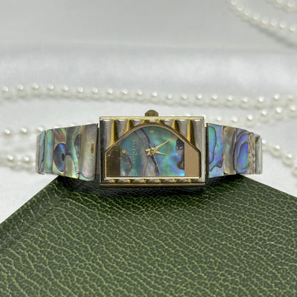 Vintage gold tone LA Express halfmoon watch with abalone rectangular dial and stretchable abalone panel band