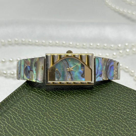 Vintage gold tone LA Express halfmoon watch with abalone rectangular dial and stretchable abalone panel band