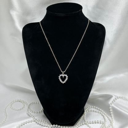Vintage silver tone heart necklace with CZ stones.