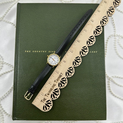 Classic Gold Timex Indiglo Watch with Black Leather Band and Date Display