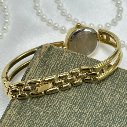 Gold Carriage Cuff Watch