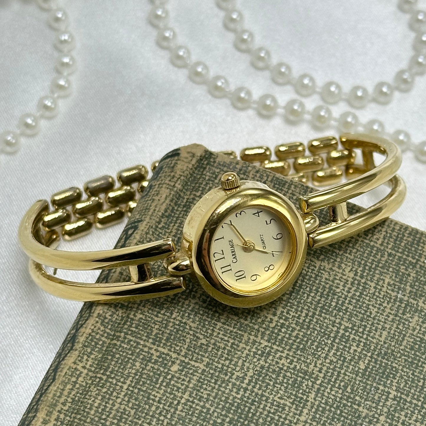 Gold Carriage Cuff Watch