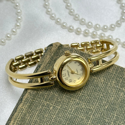 Gold Carriage Cuff Watch
