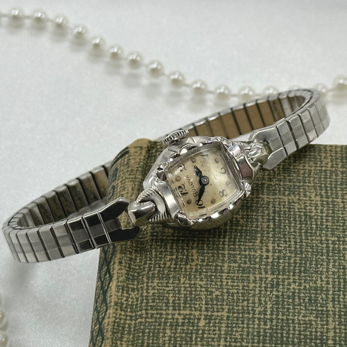 Bulova 10k rolled gold-plated manual winding watch with blue hands and stretchable band from the 1950's