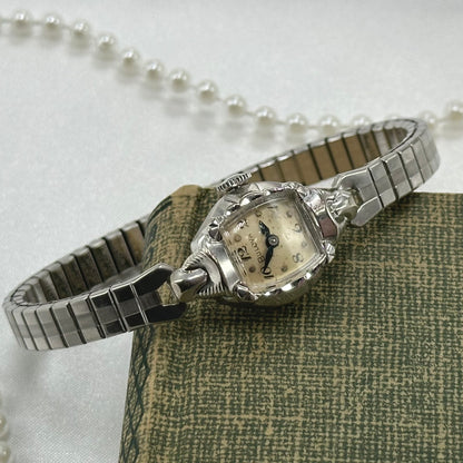 Bulova 10k rolled gold-plated manual winding watch with blue hands and stretchable band from the 1950's
