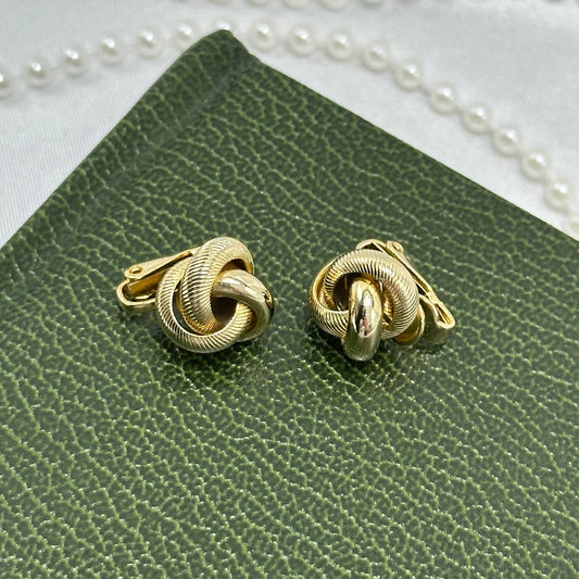Vintage gold tone metal twist clip on earrings.