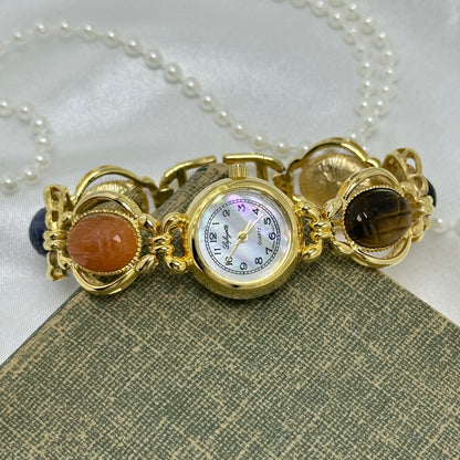 Vintage Gold Scarab Watch with Mother of Pearl Dial