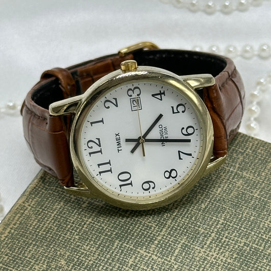 Gold and Brown Timex Indiglo Watch