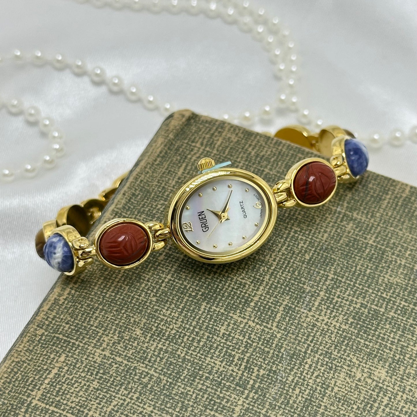 Gold Gruen Scarab Watch with Mother of Pearl Dial