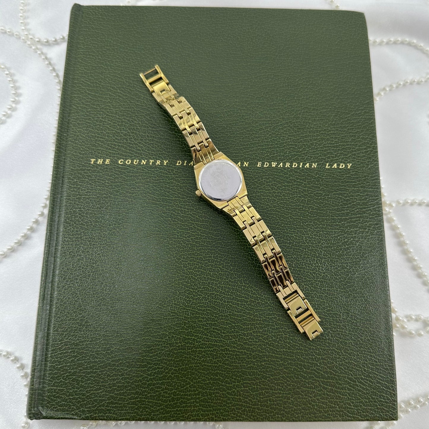 Queen's Court Gold Relic Watch with Crystal Accents and Date Display