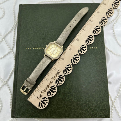 Gold Relic Diamanté Watch with Metallic Leather Band and Date Display