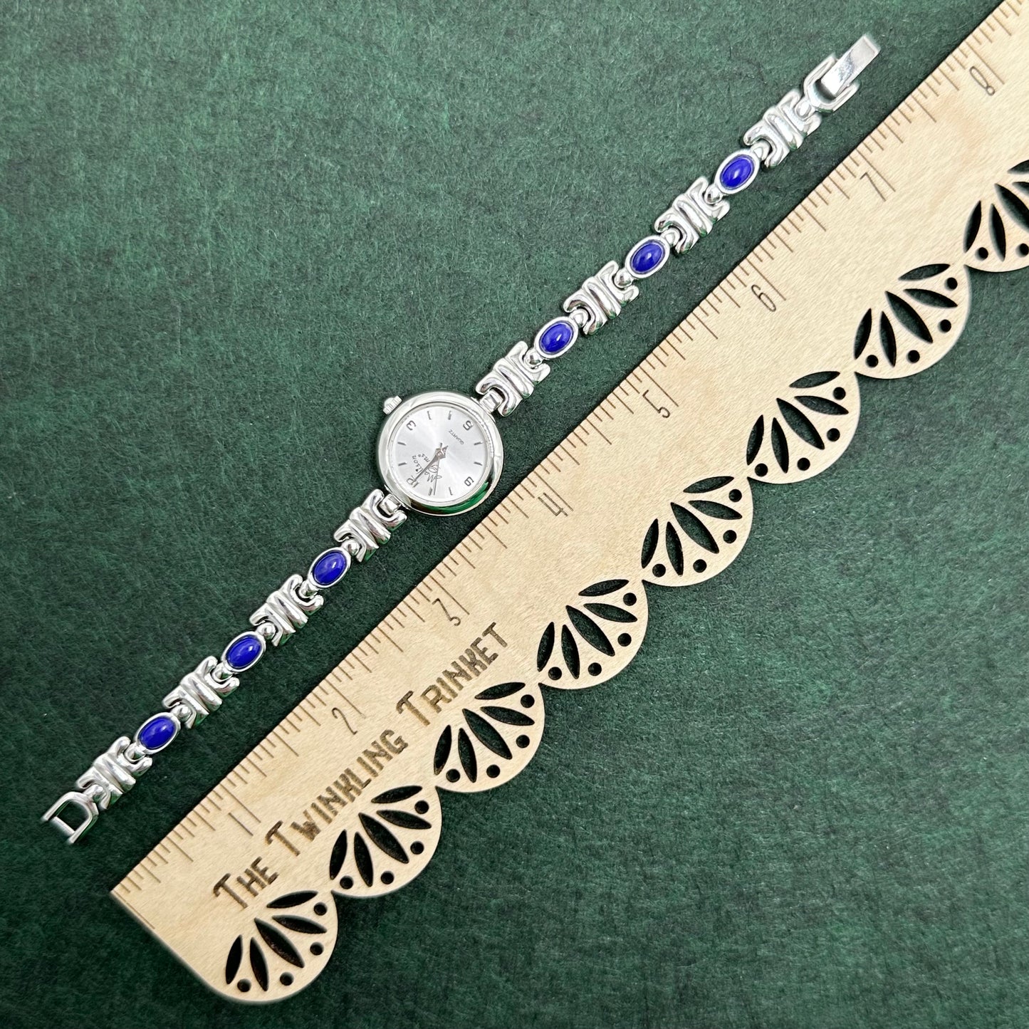 Silver Round Dial Watch with Blue Gemstone Band