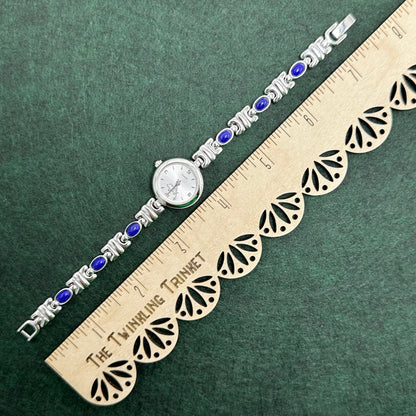 Silver Round Dial Watch with Blue Gemstone Band
