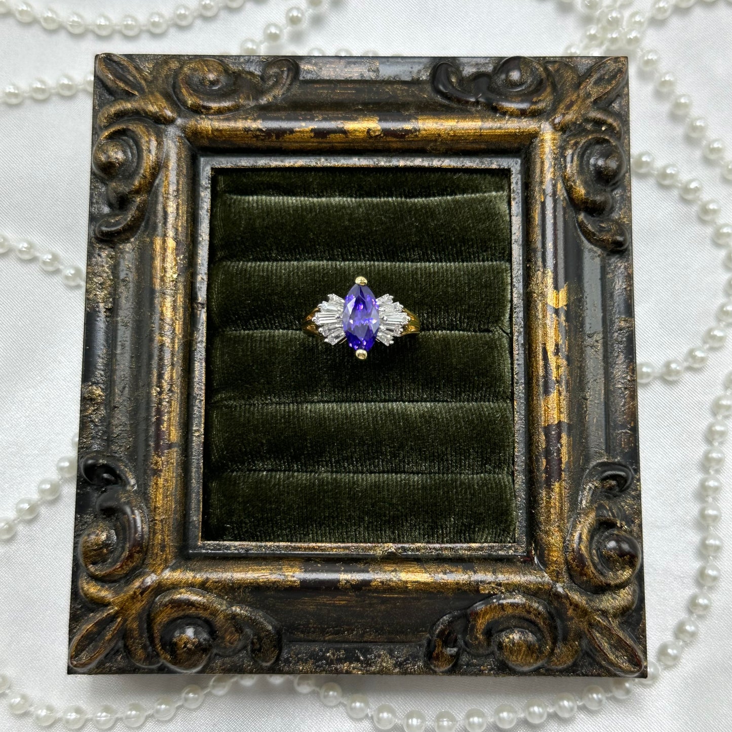 14k gold electroplated vintage deadstock cocktail ring with diamond shaped purple stone and cubic zirconia stones.