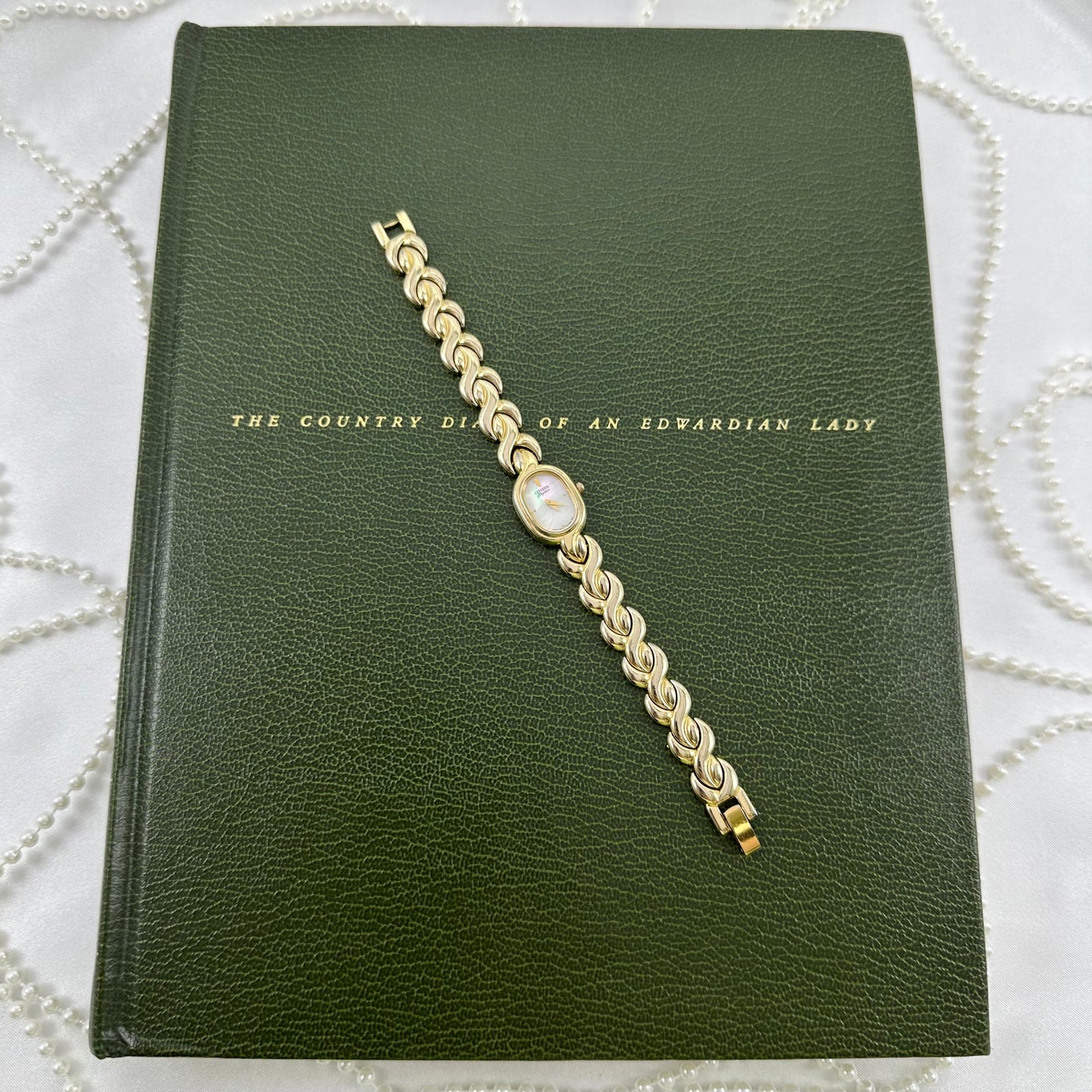Dainty Gold Citizen Watch with Mother of Pearl Dial