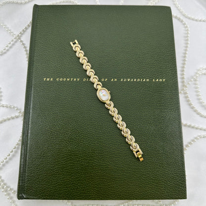 Dainty Gold Citizen Watch with Mother of Pearl Dial