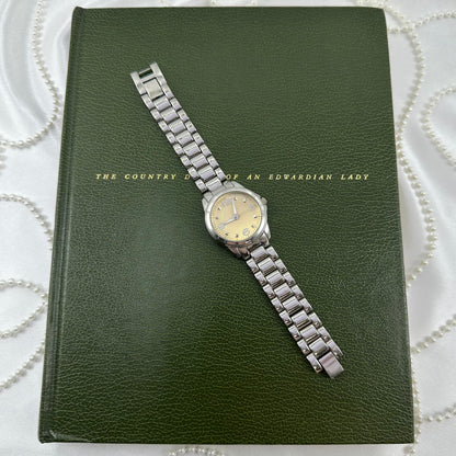 Silver Round Champagne Dial Watch