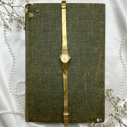 Gold tone Elgin Diamond watch with quartz movement.