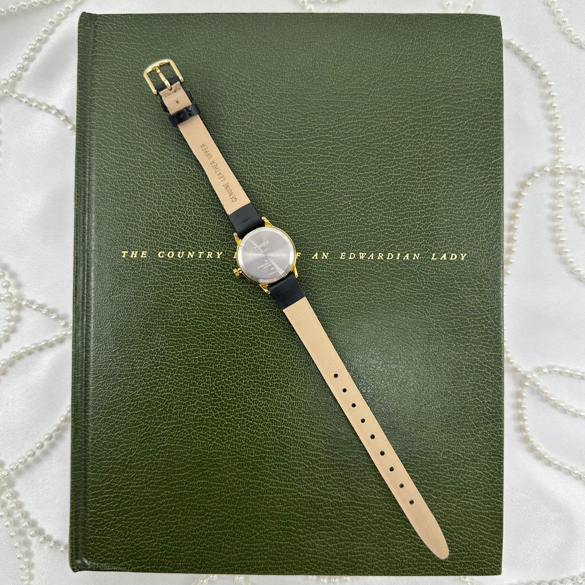 Classic Gold Timex Indiglo Watch with Black Leather Band and Date Display