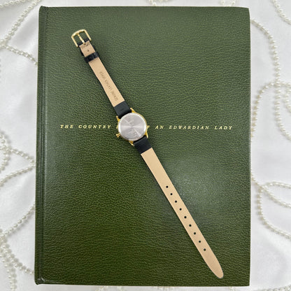 Classic Gold Timex Indiglo Watch with Black Leather Band and Date Display