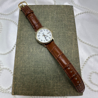 Gold and Brown Timex Indiglo Watch