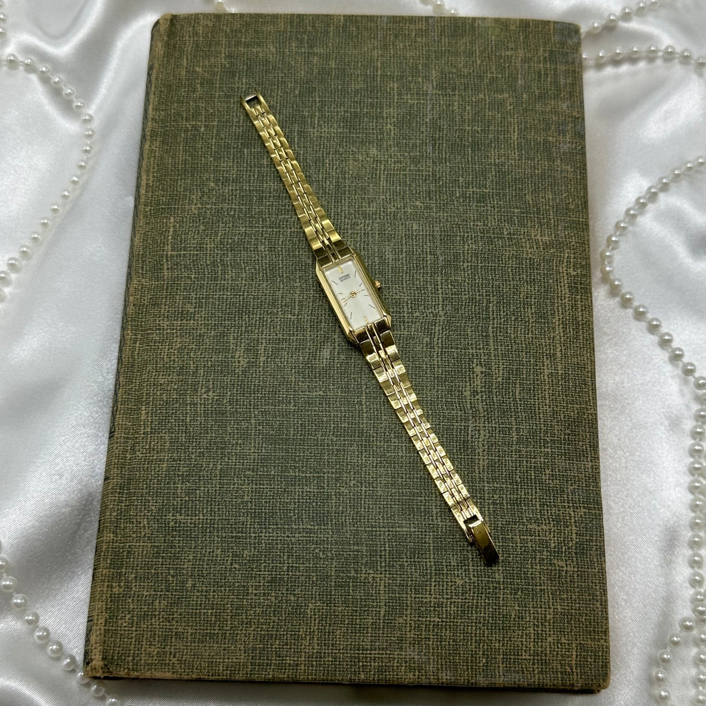 Dainty gold tone Citizen watch with quartz movement.