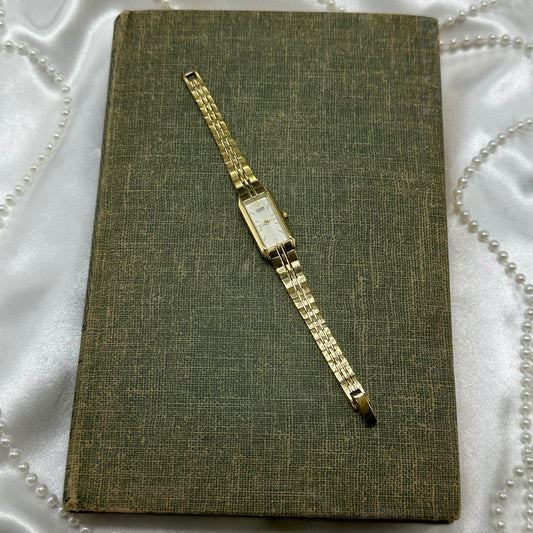 Dainty gold tone Citizen watch with quartz movement.