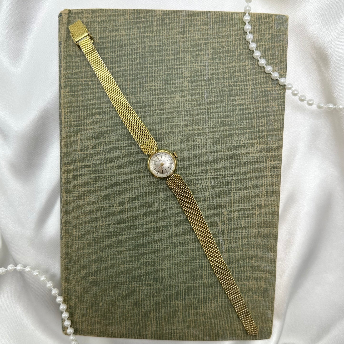 Dainty gold tone Germinal Voltaire manual winding watch. 17 jewels.